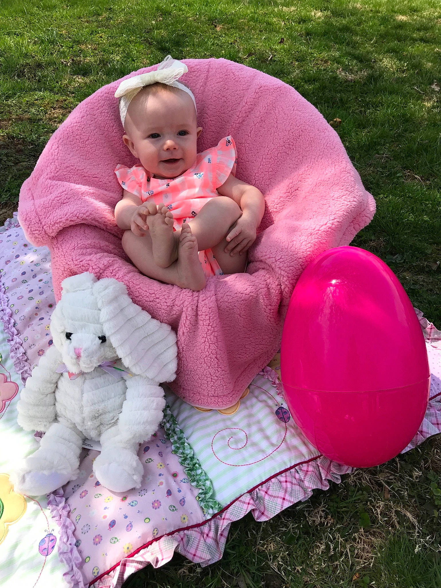 Kamilla is registered to the contest to win money with this photo: baby, baby_products, baby_toys, child, grass, person, pink, play, product, sitting, stuffed_toy, toddler