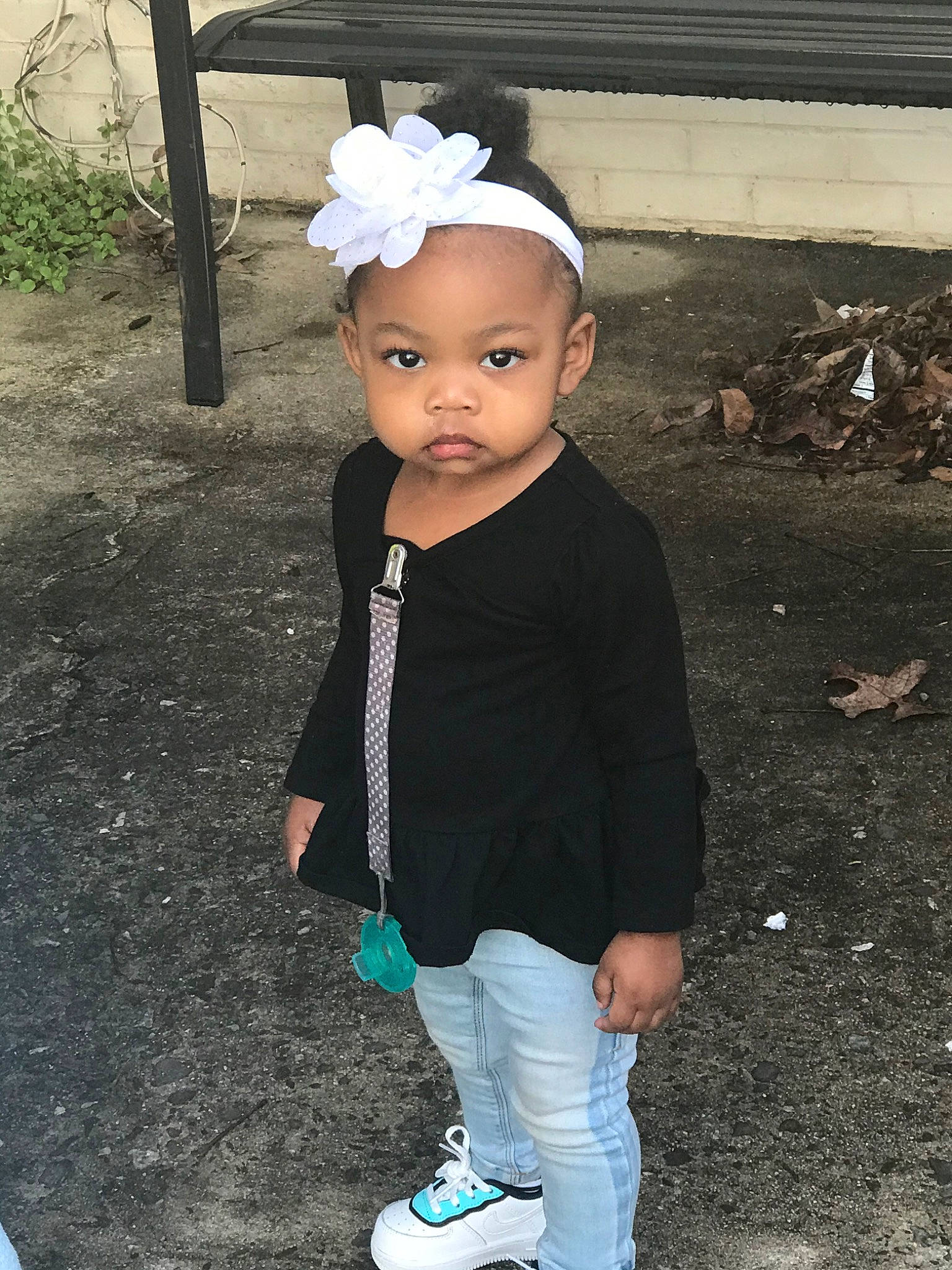 Breanna is registered to the contest to win money with this photo: baby, baby_toddler_clothing, child, child_model, clothing, cool, footwear, hair_accessory, head, headband, headgear, jeans, outerwear, person, product, shoe, smile, standing, toddler, turquoise