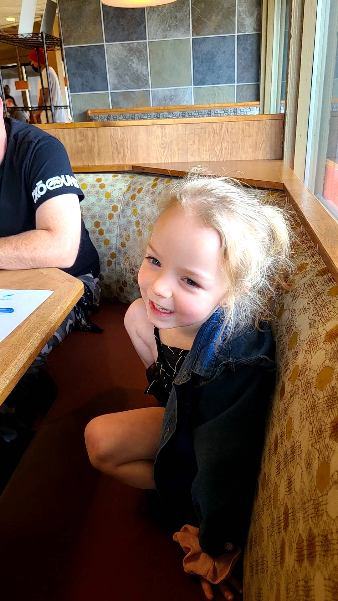 Ryleigh is registered to the contest to win money with this photo: chair, child, flooring, fun, fur, happy, hardwood, joy, leisure, person, play, room, sitting, smile, t_shirt, table, toddler, vacation, window, wood