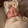 Mia-Bella is registered to the contest to win money with this photo: baby, sleeping, blanket, knitwear, hat, bow, infant, wrapped, cozy, closeup, face, soft, warm, texture, peaceful, child, indoors, portrait, newborn, cute