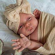 Mia-Bella joined the competition — help win amazing prizes! baby, infant, blanket, headwrap, bow, hand, plush_toy, soft_toy, fabric, knit, cozy, cute, sleepy, wrapped, texture, bed, resting, child, person, indoor