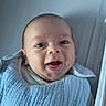 Louis participe au concours pour gagner de l'argent avec cette photo : baby, infant, smiling, blanket, crib, blue, happy, face, eyes, clothing, bed, child, newborn, cute, person, portrait, lying_down, indoors, soft, cozy