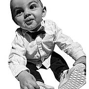 Jules participe au concours pour gagner de l'argent avec cette photo : toddler, child, baby, shirt, bow_tie, sneakers, footwear, hand, face, eyes, smile, curious, portrait, clothing, cute, young, fashion, white_shirt, black_pants, isolated_background