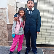 Valentina a rejoint le concours — aidez-le/la à gagner de superbes lots ! accessories, adult, blazer, child, clothing, coat, face, female, formalwear, girl, glove, head, jacket, male, man, pants, person, standing, suit, tie