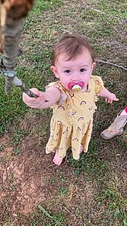 Kylee joined the competition — help win amazing prizes! baby, baby_toddler_clothing, ball, child, dance, foot, fun, grass, head, people_in_nature, person, play, sitting, soil, thumb, toddler, toy, wood, yard