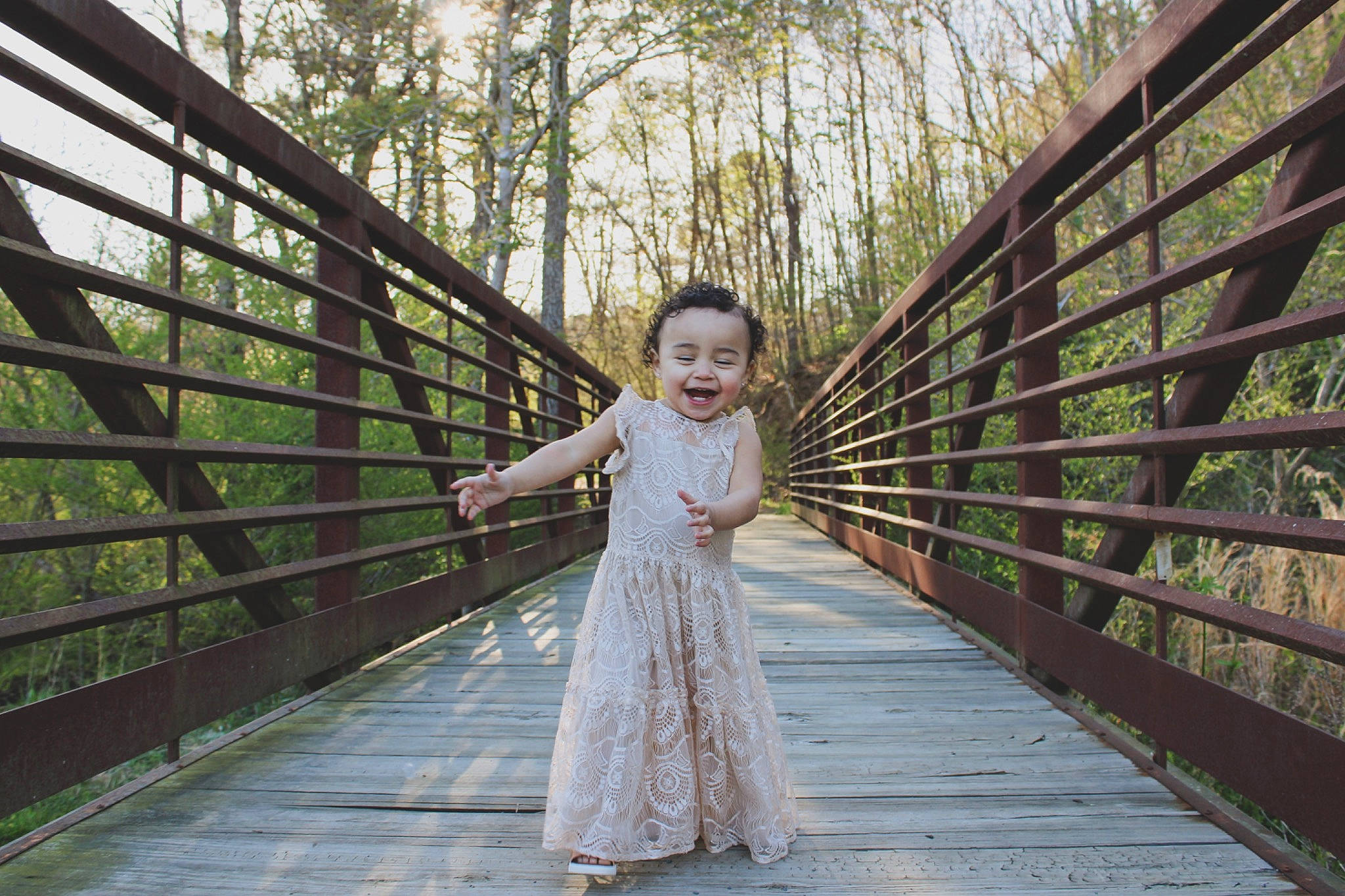 Eydi Grace is registered to the contest to win money with this photo: beauty, branch, bridal_party_dress, bridge, dress, flash_photography, forest, grass, happy, leisure, mammal, natural_landscape, people_in_nature, person, plant, smile, standing, toddler, tree, wood