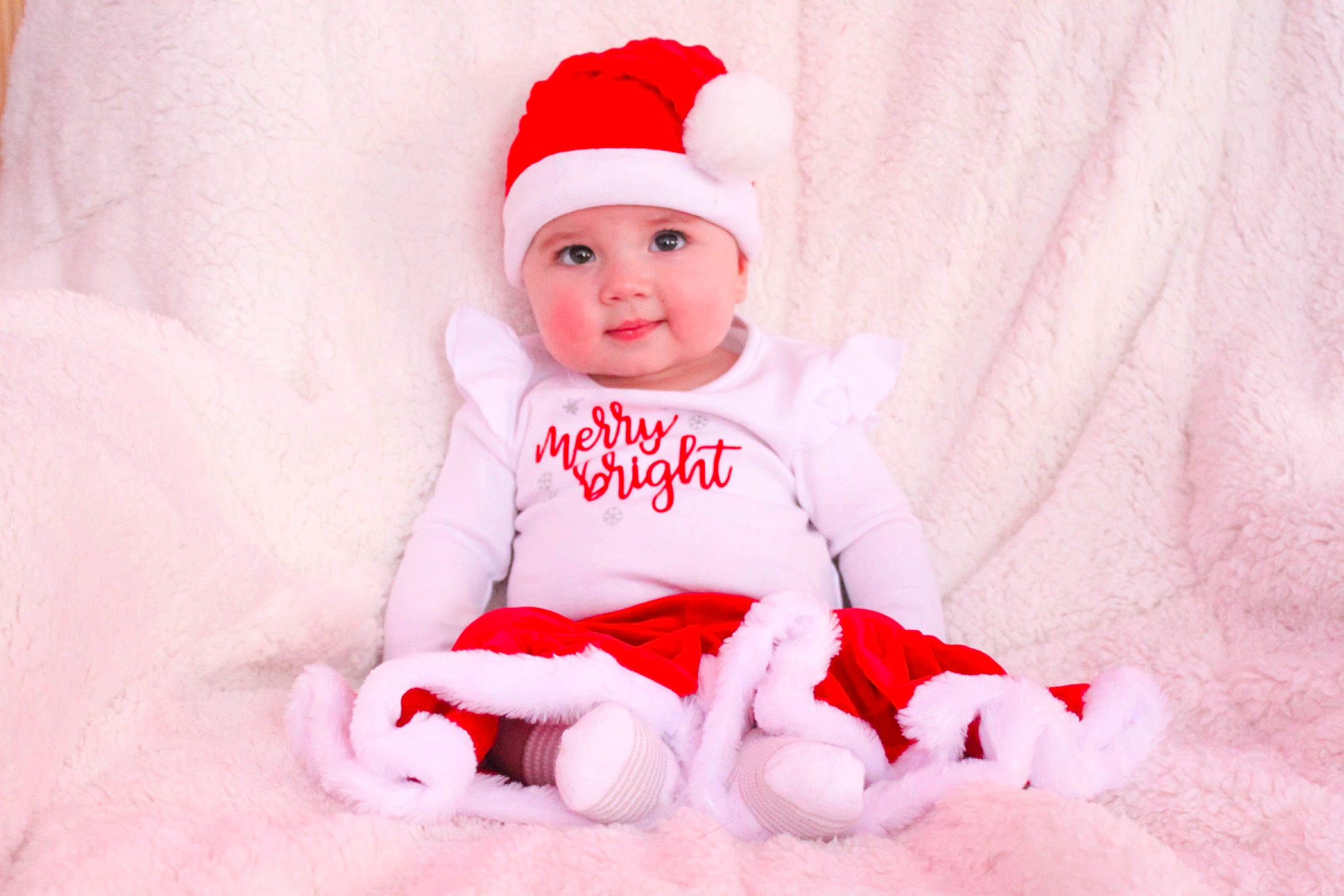 Ayda is registered to the contest to win money with this photo: baby, baby_toddler_clothing, cap, carmine, child, christmas, christmas_eve, comfort, costume_hat, event, face, happy, hat, headwear, holiday, magenta, pattern, person, pink, sleeve