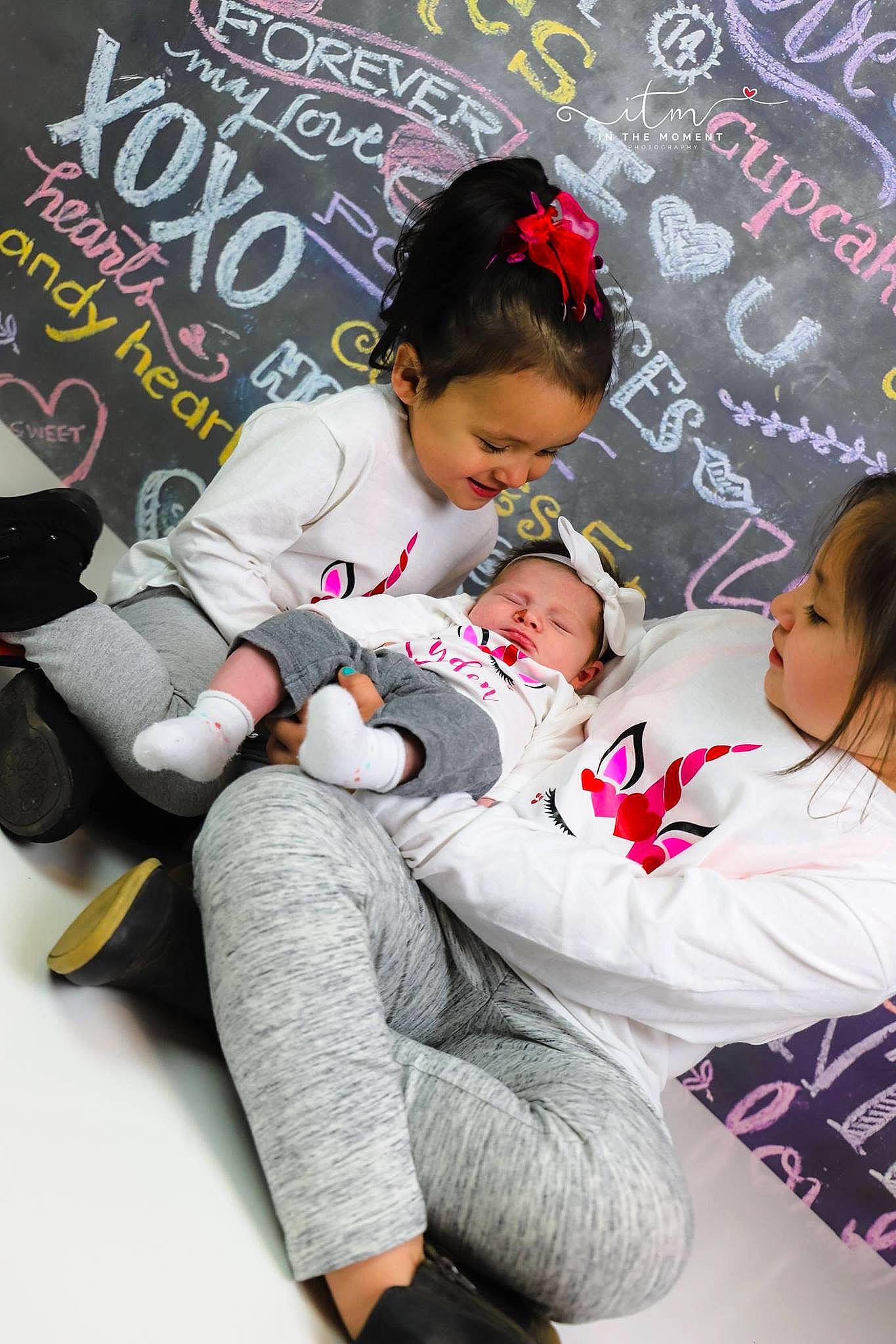 Ayden is registered to the contest to win money with this photo: baby, black_hair, child, daughter, leg, person, pink, sitting, toddler