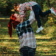 Roseary joined the competition — help win amazing prizes! affection, casual_clothing, child, fall, family, forest, greenery, happy, jeans, lifting, nature, outdoor, plaid_shirt, playful, red_hair, smiling, sneakers, sunlight, trees, woman