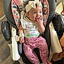 Lilyana joined the competition — help win amazing prizes! baby, bow, celebration, child, cute, fingers, floor, floral_pattern, footwear, hand, happy, headband, highchair, indoor, infant, person, pink_pants, shirt, smiling, text