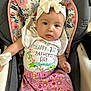 Lilyana joined the competition — help win amazing prizes! baby, baby_seat, bow, child, clothing, cushion, cute, expression, face, floral_pattern, headband, indoor, infant, person, pink_pants, portrait, sitting, text_on_clothing, white_shirt, young_child