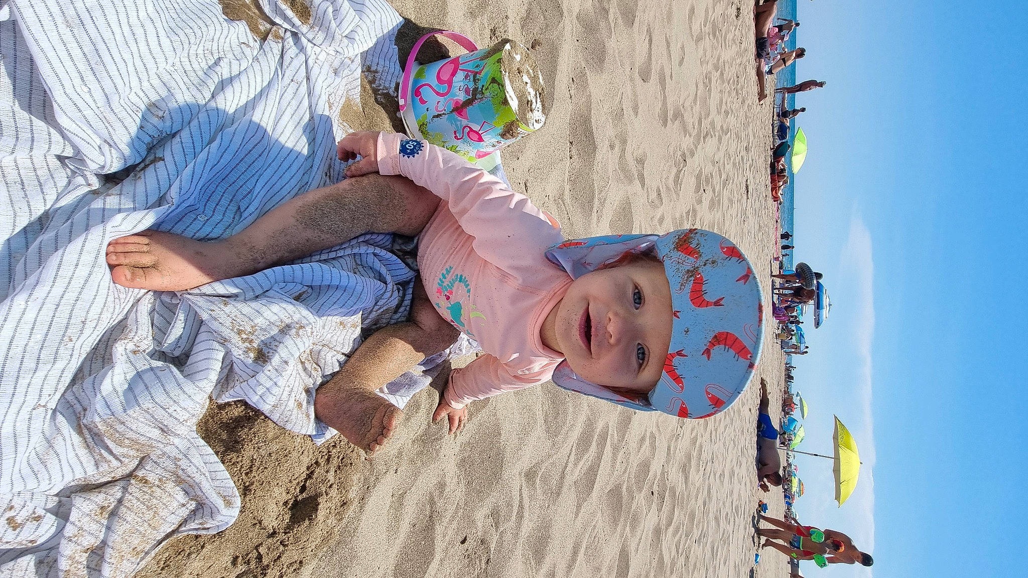 Naïa participe au concours pour gagner de l'argent avec cette photo : art, azure, beach, child, eyewear, fun, happy, hat, headwear, leisure, person, play, recreation, sand, shorts, sky, t_shirt, thigh, toddler, tree