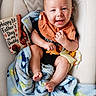 baby, bib, blanket, blue, celebration, child, cute, face, fathers_day_card, foot, hand, happy, indoor, infant, onesie, orange, portrait, seated, smiling, soft_toy