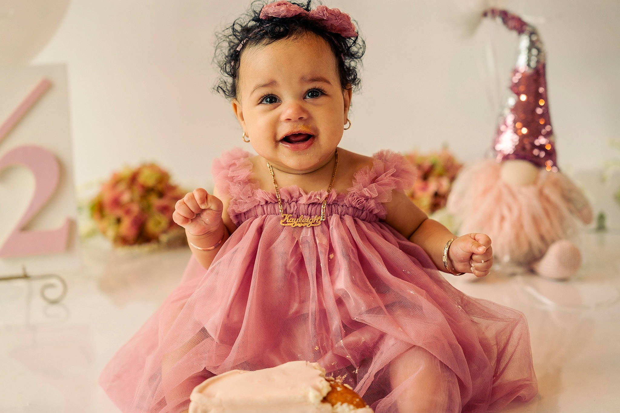 Kayleigh is registered to the contest to win money with this photo: baby, baby_toddler_clothing, child, dress, event, face, fashion_accessory, fun, hair_accessory, happy, headpiece, magenta, pattern, peach, person, pink, purple, sleeve, smile, sweetness