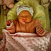 Yeva participe au concours pour gagner de l'argent avec cette photo : baby, bed, blanket, child, clothing, cozy, cute, hands, hat, indoors, infant, newborn, peaceful, pink, plush_toy, portrait, resting, sleeping, soft_toys, warm