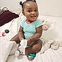 He'Liey is registered to the contest to win money with this photo: baby, child, smiling, sitting, bed, blanket, pacifier, clothing, onesie, sock, tissue, toy, indoor, cute, happy, portrait, person, infant, hair, face