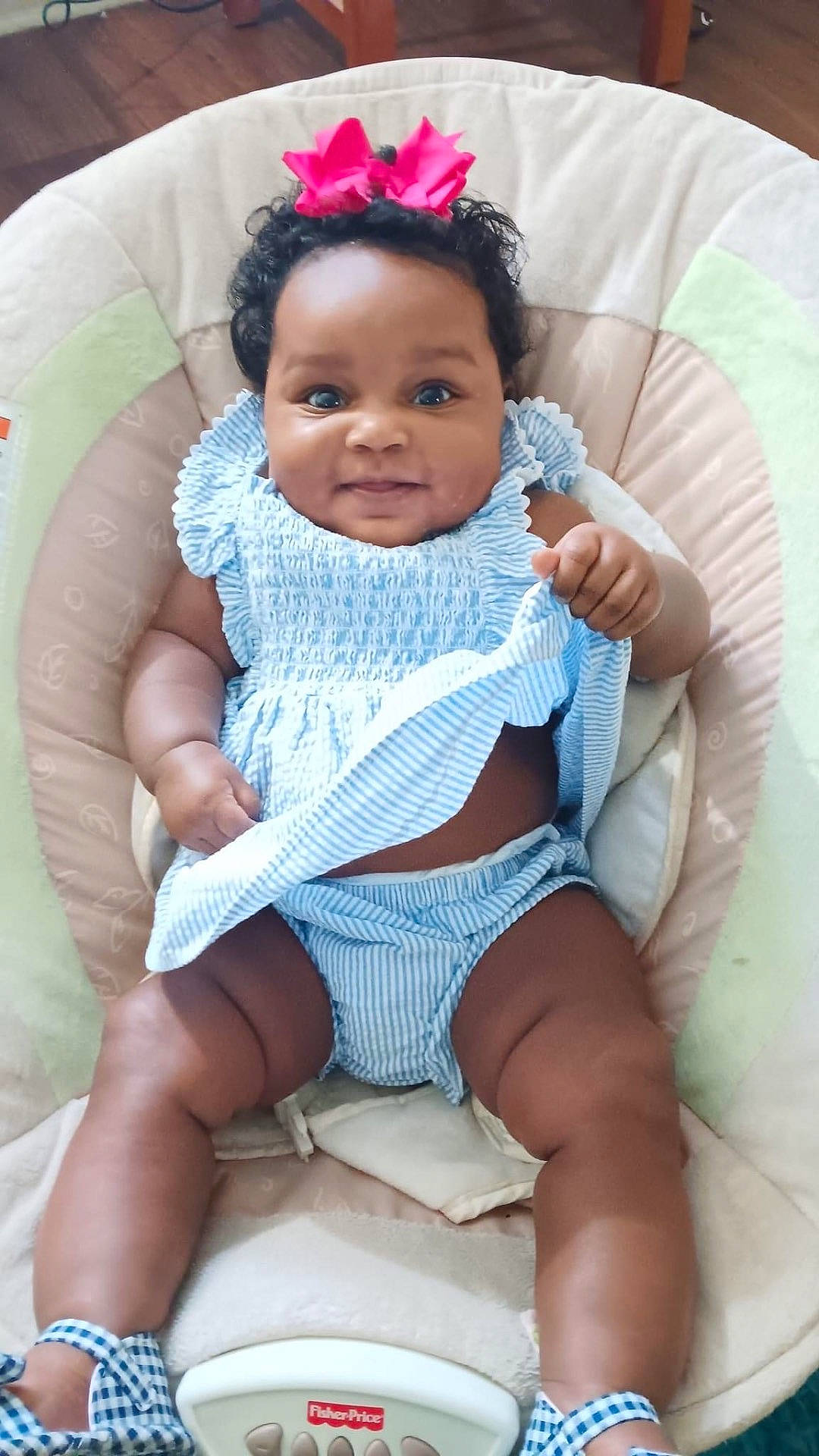 He'Liey joined the competition — help win amazing prizes! baby, baby_seat, blue_outfit, child, chubby_legs, curly_hair, cute, fisher_price, footwear, happy, home, indoor, infant, person, pink_bow, plump, portrait, sitting, smiling, striped_clothing