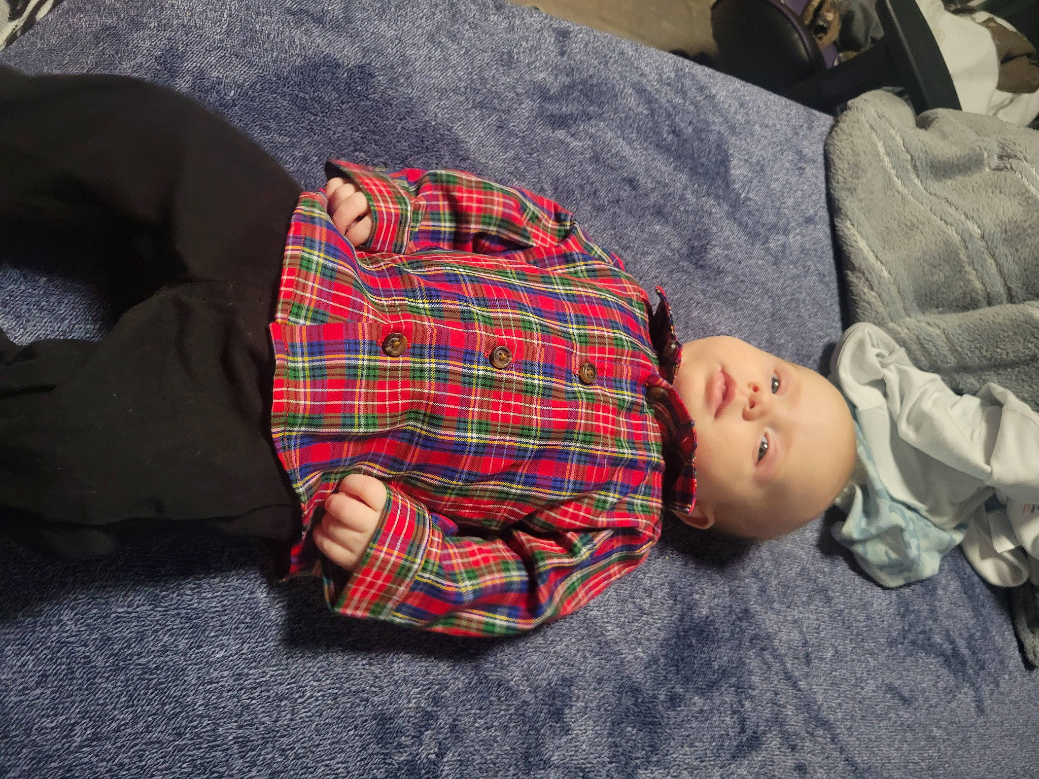 Daxton joined the competition — help win amazing prizes! baby_toddler_clothing, child, comfort, couch, linens, pattern, person, plaid, sitting, sleeve, tartan, textile, toddler, wood