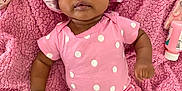 Zenaaliyah is registered to the contest to win money with this photo: baby, infant, pink_clothing, polka_dot, bonnet, blanket, soft_texture, lying_down, cute, child, skin, indoors, baby_care, sock, headwear, apparel, person, face, expression, newborn