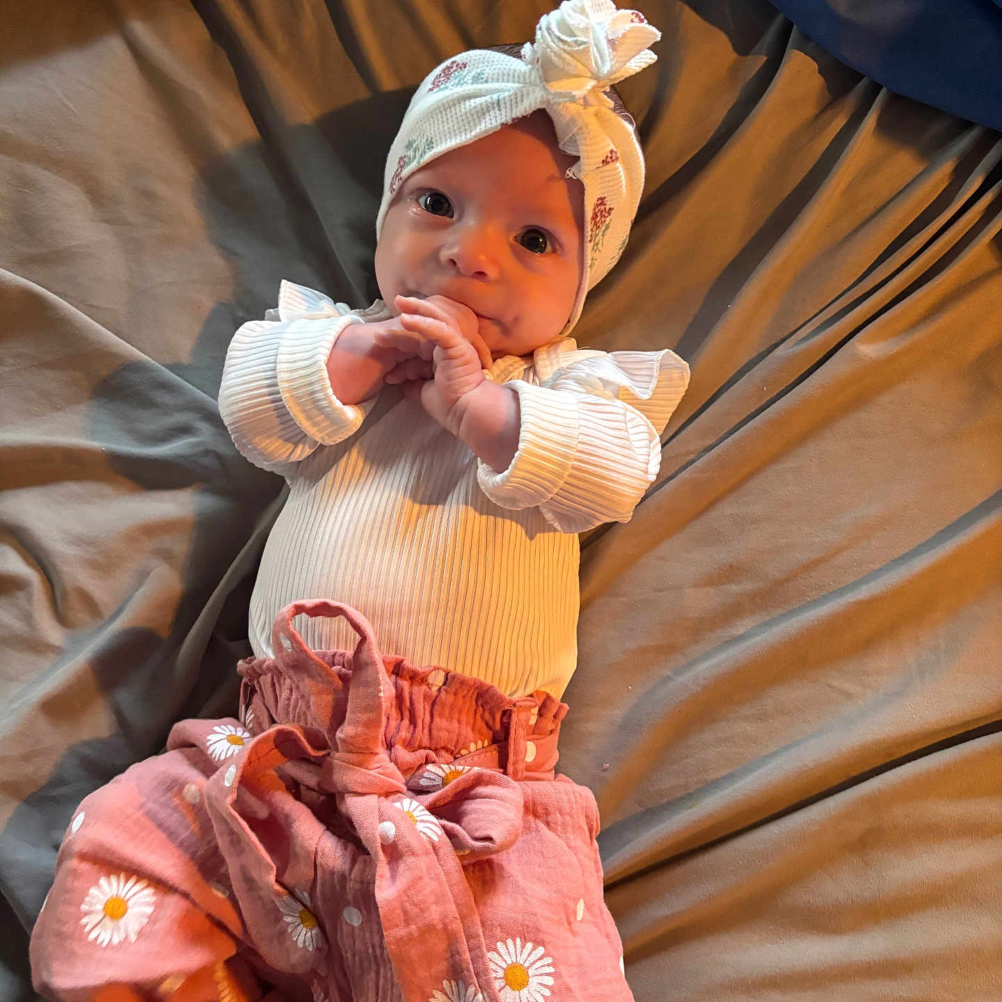 Lainey joined the competition — help win amazing prizes! baby, bodypart, bonnet, cap, clothing, couch, dress, face, finger, formalwear, furniture, hand, hardwood, hat, head, newborn, person, photography, portrait, sitting