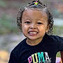 Oaklynn joined the competition — help win amazing prizes! child, smiling, curly_hair, tshirt, black_tshirt, outdoor, portrait, happy, young_child, face, hair_accessory, toy, casual_clothing, daylight, cute, person, childhood, colorful, playful, childrens_fashion