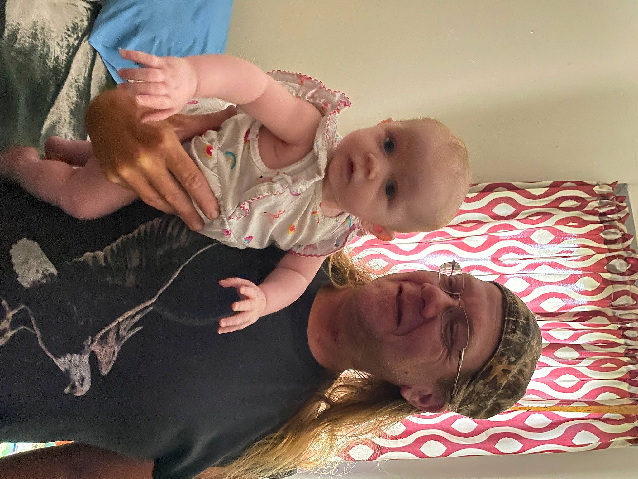 Laylonie is registered to the contest to win money with this photo: abdomen, arm, baby, baby_toddler_clothing, chest, child, comfort, fun, gesture, hand, happy, headwear, jewellery, mouth, muscle, pattern, person, room, sitting, smile