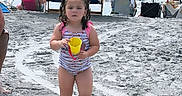 Kaylee joined the competition — help win amazing prizes! child, toddler, beach, sand, bucket, umbrella, ocean, waves, water, people, swimsuit, summer, vacation, outdoor, sunny, relaxation, family, holiday, footprints, chair