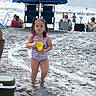 child, toddler, beach, sand, bucket, umbrella, ocean, waves, water, people, swimsuit, summer, vacation, outdoor, sunny, relaxation, family, holiday, footprints, chair