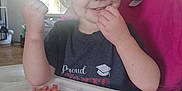Eleanore joined the competition — help win amazing prizes! toddler, child, high_chair, food, sausage, indoor, window, smiling, happy, hair, face, clothing, plate, table, person, daylight, home, cheerful, meal, fist