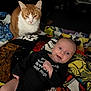 Zayden is registered to the contest to win money with this photo: baby, cat, star_wars, blanket, onesie, orange_cat, white_cat, smile, happy, indoor, furniture, fan, lamp, portrait, person, animal, pet, cozy, colorful, expression