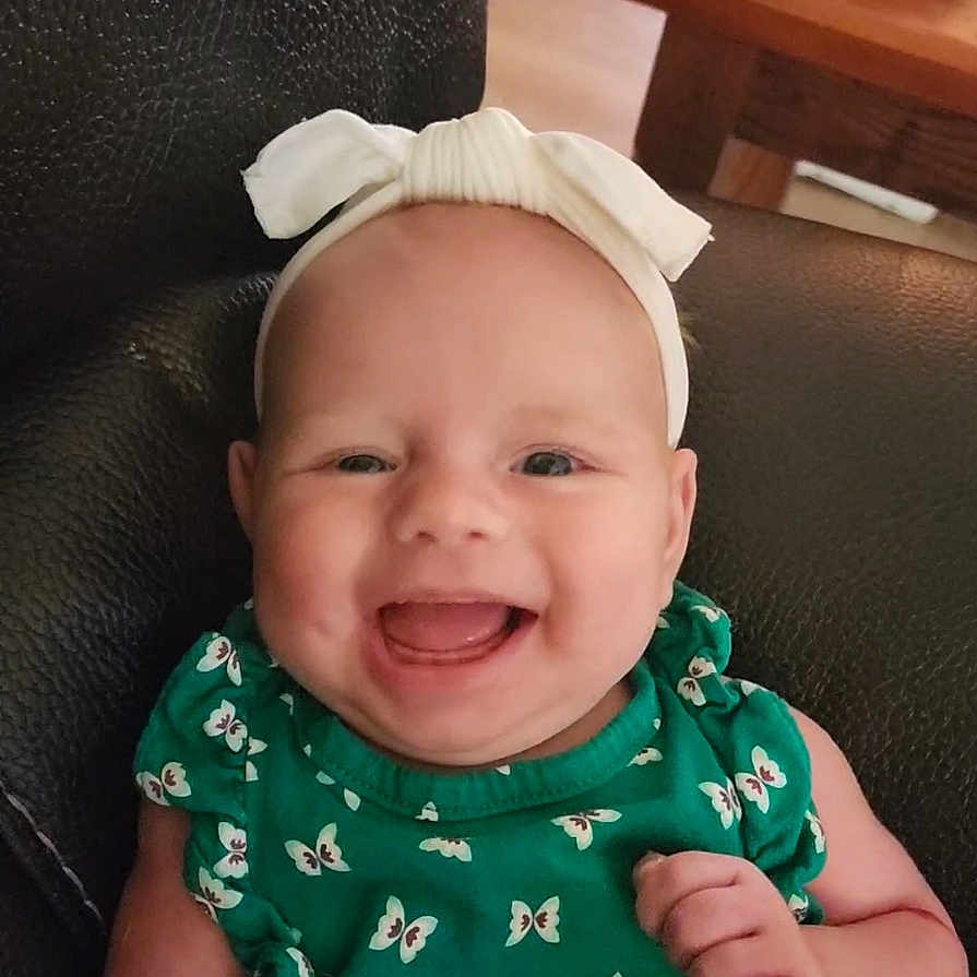 Aubree John is registered to the contest to win money with this photo: accessories, baby, babylaughing, bodypart, clothing, cushion, face, happy, hat, head, homedecor, jewelry, laughing, mouth, necklace, newborn, person, photography, portrait, smile
