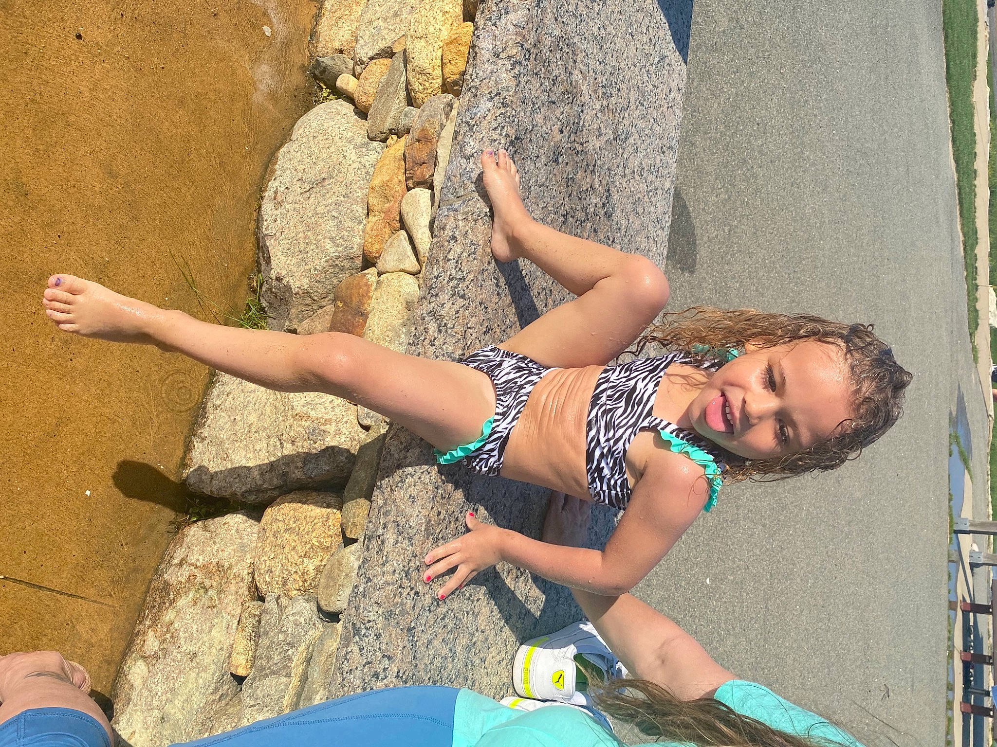 Avianna is registered to the contest to win money with this photo: barefoot, blue, calf, elbow, foot, fun, glasses, human_body, human_leg, joint, knee, leg, leisure, people_in_nature, person, shorts, street_fashion, swimwear, thigh, trunk