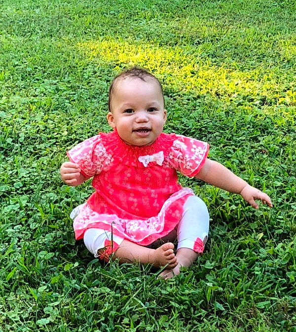 Emery is registered to the contest to win money with this photo: baby, baby_toddler_clothing, botany, field, fun, garden, grass, grassland, groundcover, happy, lawn, leaf, meadow, nature, people_in_nature, person, plant, smile, soil, summer