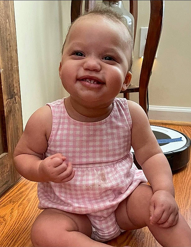 Emery is registered to the contest to win money with this photo: baby, baby_toddler_clothing, cheek, face, happy, head, human, human_body, iris, joint, joy, lip, neck, nose, person, product, skin, sleeve, smile, standing