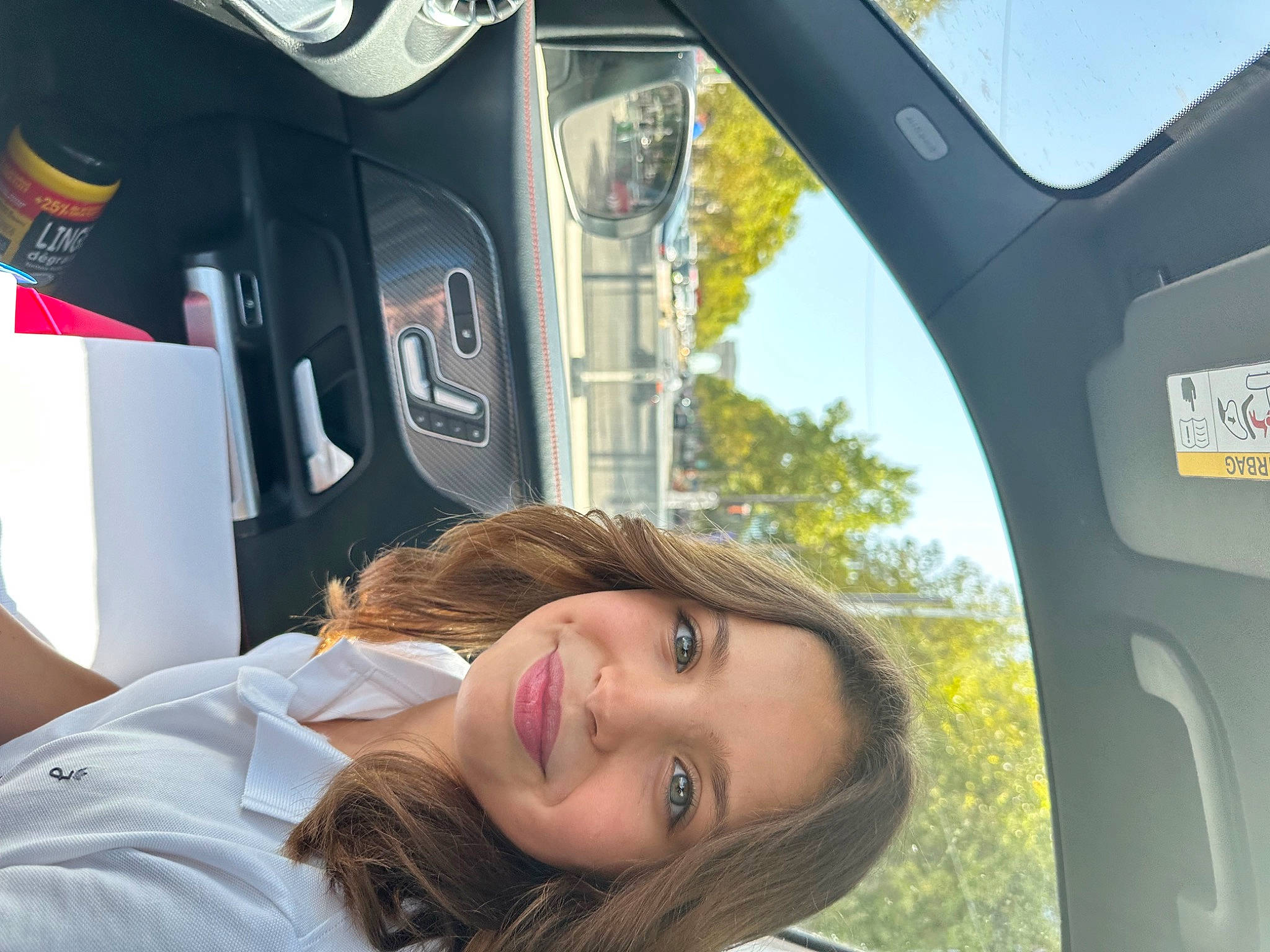 Serina participe au concours pour gagner de l'argent avec cette photo : auto_part, automotive_design, automotive_exterior, automotive_mirror, family_car, fun, grass, happy, joy, leisure, motor_vehicle, person, plant, rear_view_mirror, sky, smile, steering_wheel, travel, tree, vehicle_door