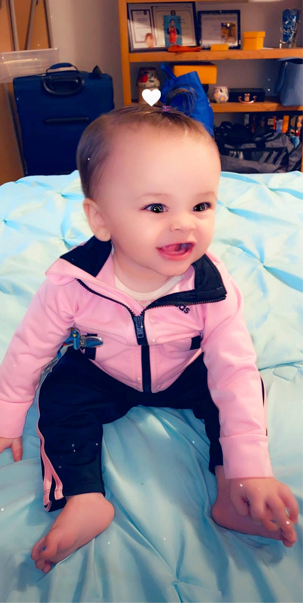 Adria is registered to the contest to win money with this photo: baby, baby_products, baby_toddler_clothing, blue, cheek, child, eye, face, head, iris, leg, lip, person, product, sitting, skin, smile, toddler