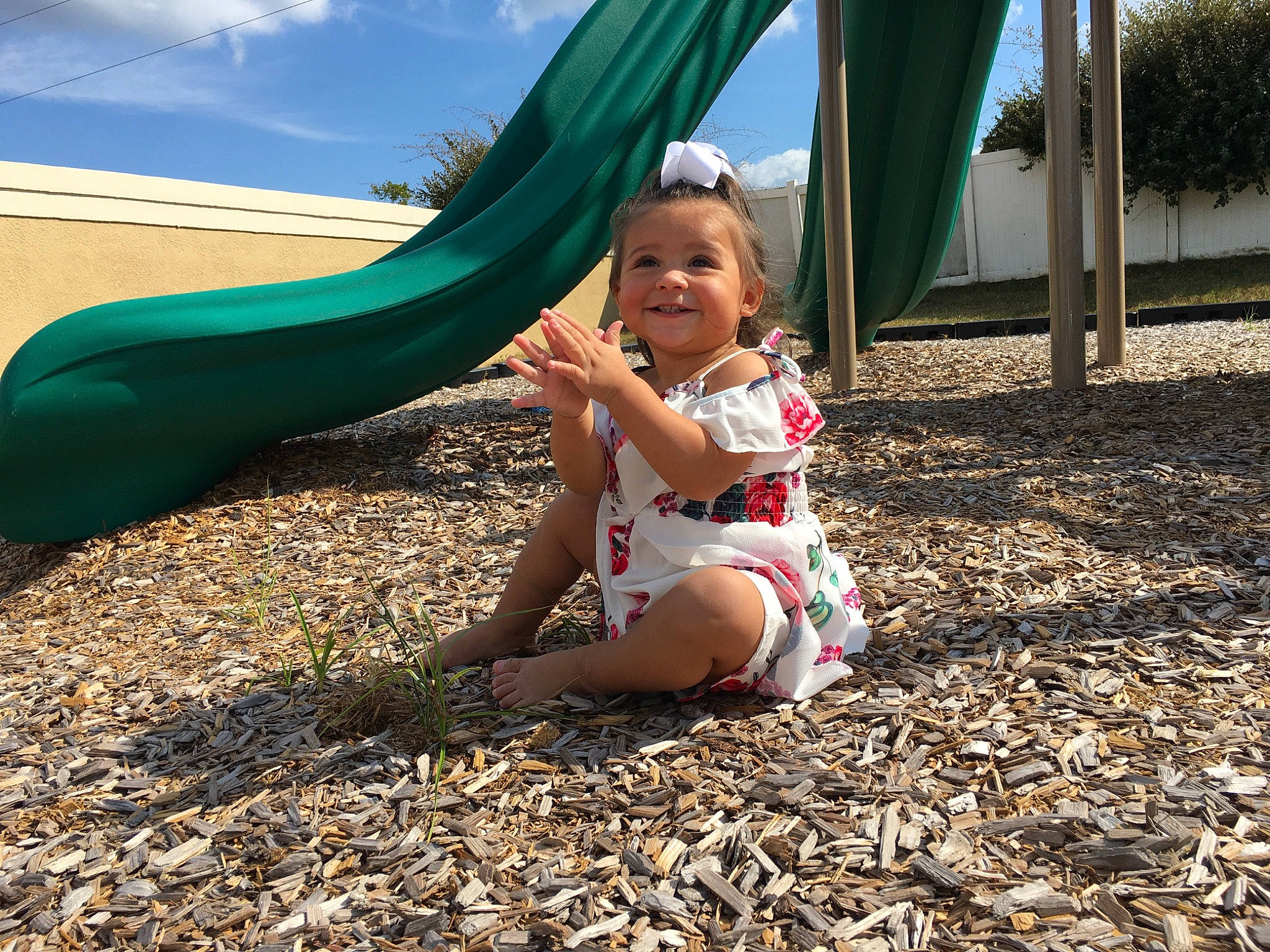 Alaina is registered to the contest to win money with this photo: adaptation, child, fun, grass, green, human_settlement, joy, leaf, leisure, outdoor_play_equipment, person, plant, play, playground, playground_slide, public_space, recreation, smile, summer, toddler