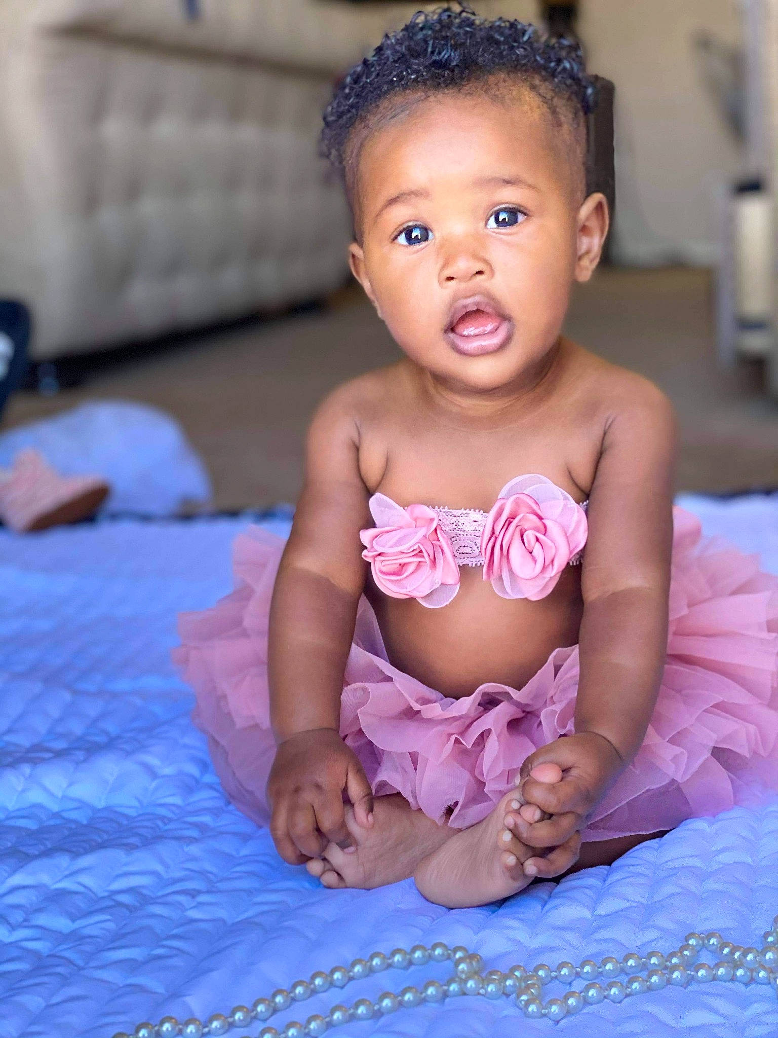 Lyrik is registered to the contest to win money with this photo: abdomen, baby, baby_bloomers, baby_toddler_clothing, bed, cheek, chest, child, ear, foot, head, human_body, linens, mouth, nose, person, pink, skin, stomach, surprise