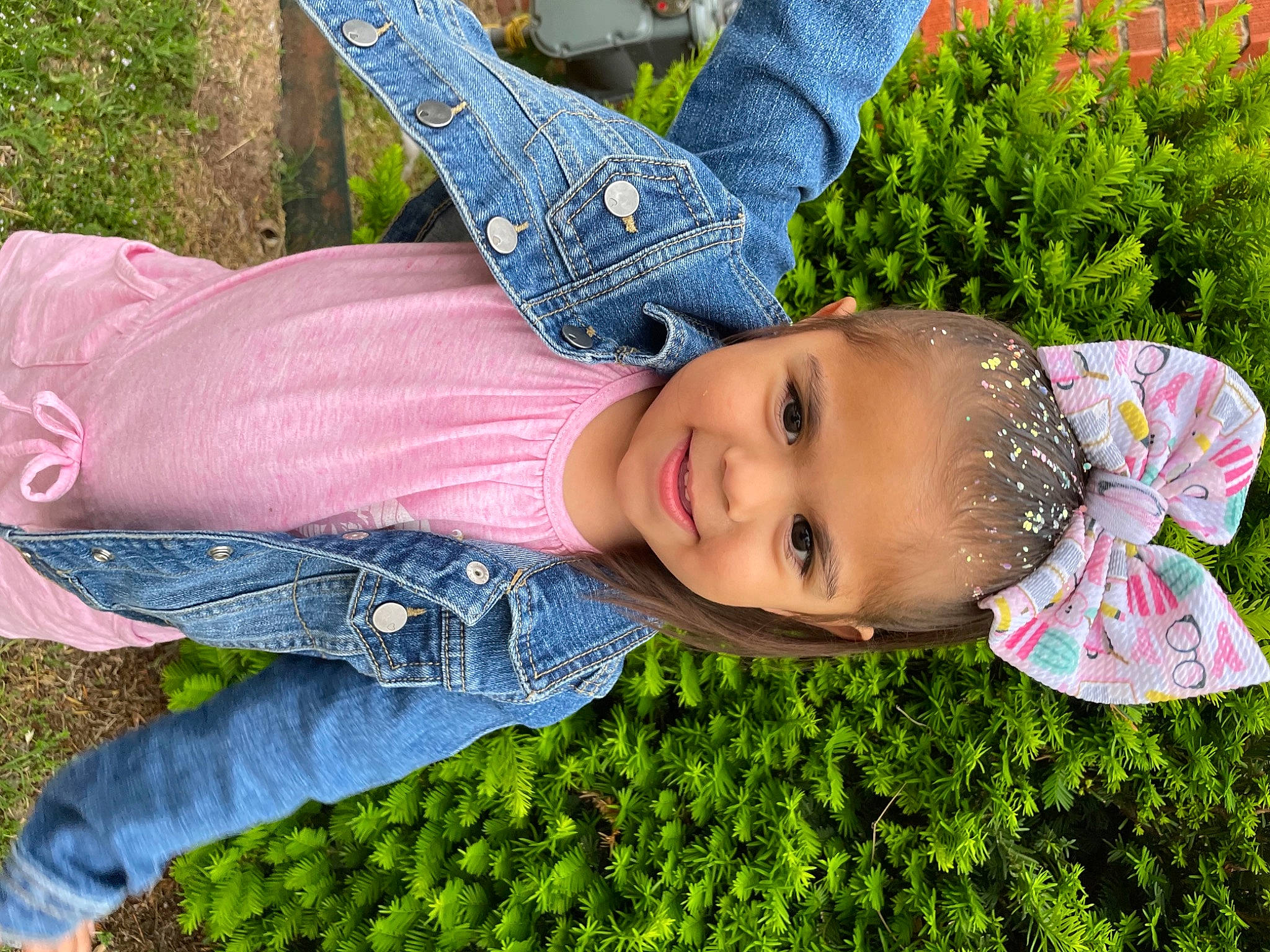 Lilliana is registered to the contest to win money with this photo: blue, denim, facial_expression, fun, grass, grass_family, green, happy, hat, jeans, joy, leaf, leisure, people_in_nature, person, photograph, plant, red, smile, textile