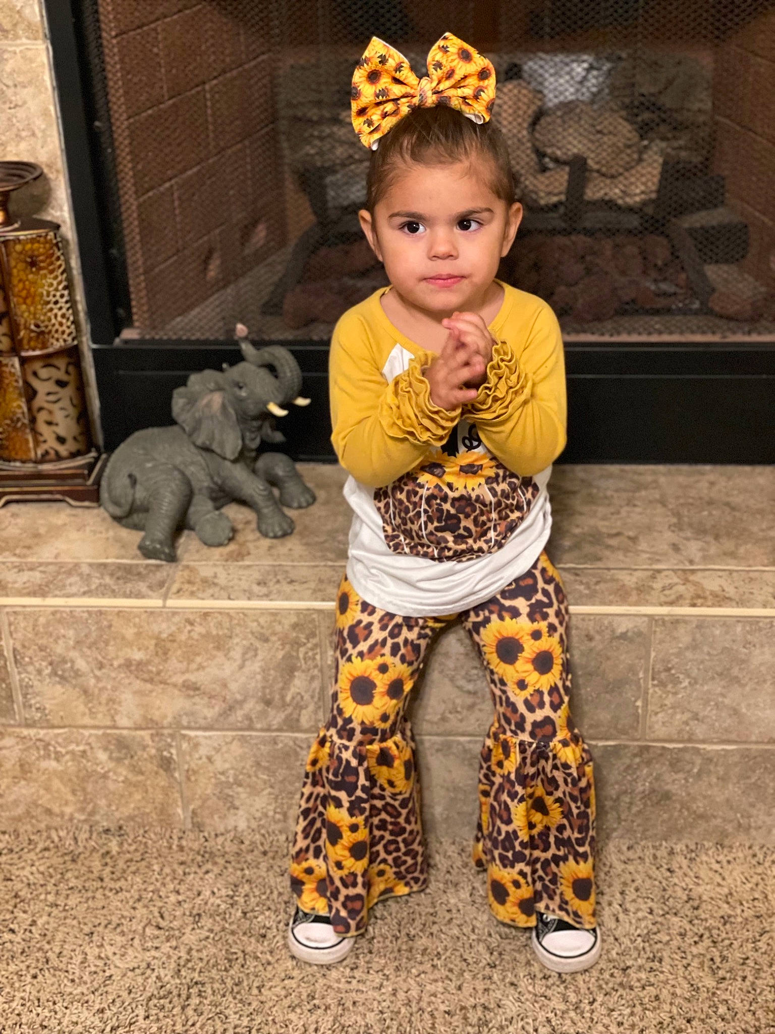 Lilliana is registered to the contest to win money with this photo: baby, crown, fashion_design, fawn, flooring, foot, fur, hat, headpiece, jewellery, metal, pattern, person, sitting, sleeve, sportswear, street_fashion, terrestrial_animal, thigh, toddler