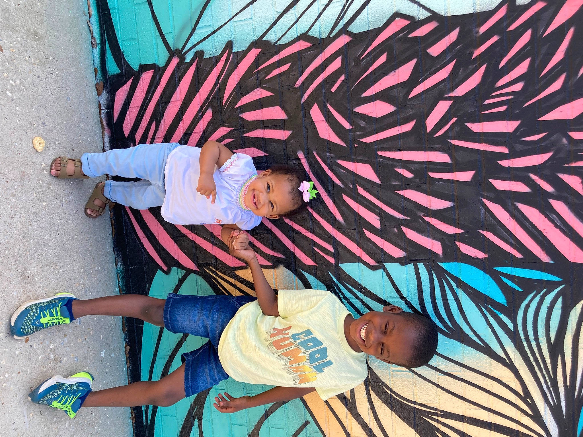 Anylah is registered to the contest to win money with this photo: art, azure, child, design, electric_blue, fun, hat, joy, leisure, line, linens, magenta, mural, pattern, person, photograph, sidewalk, t_shirt, tints_and_shades, toddler