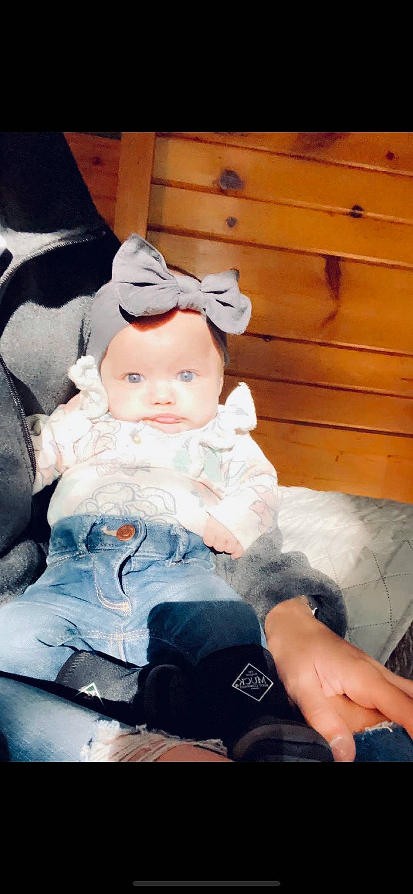 Briana is registered to the contest to win money with this photo: baby, baby_toddler_clothing, cheek, child, comfort, doll, flash_photography, fur, happy, head, headband, headwear, human_leg, lap, leg, person, sitting, skin, thigh, toddler