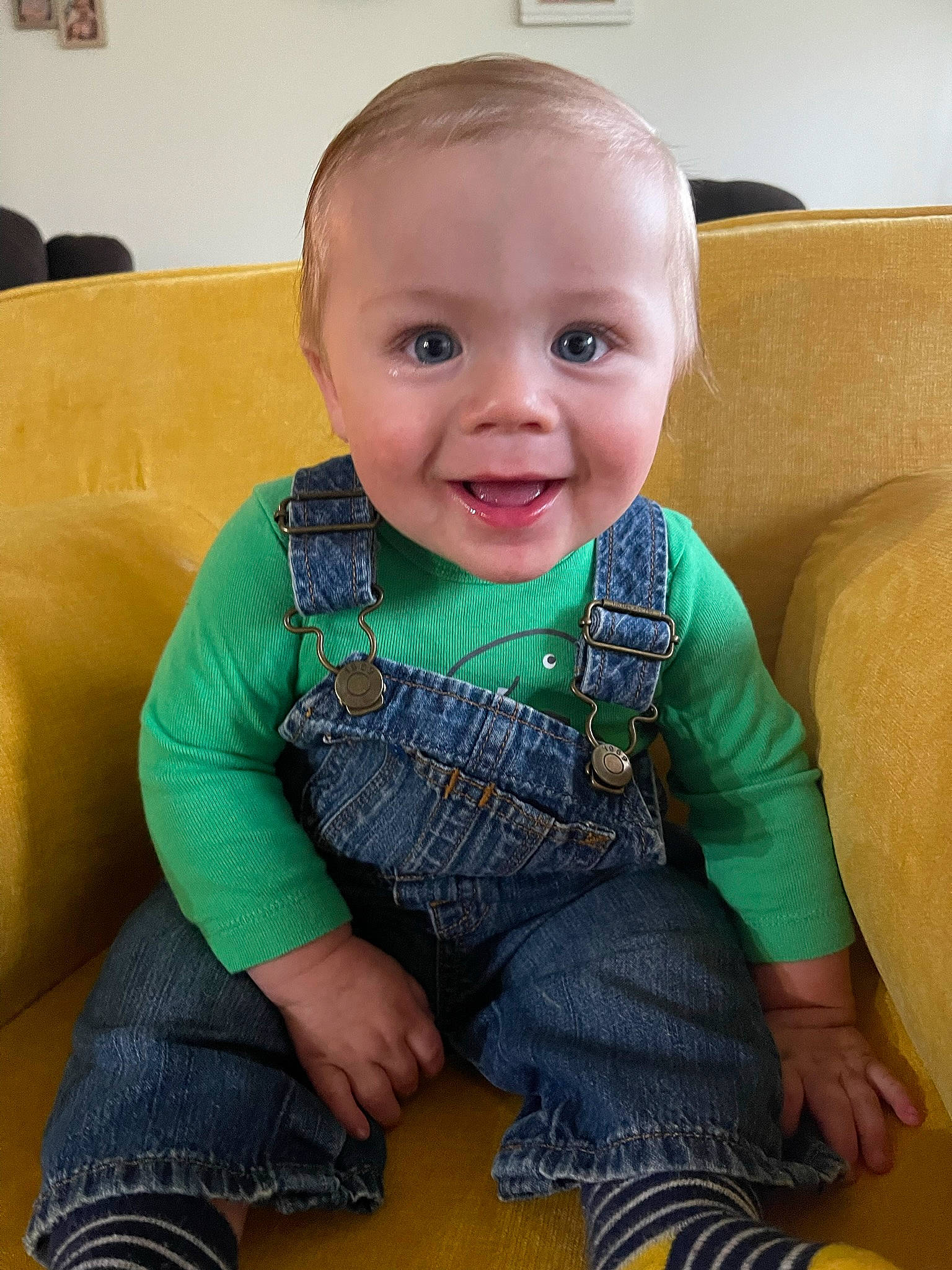 Lane is registered to the contest to win money with this photo: baby, baby_toddler_clothing, cheek, child, clothing, comfort, couch, finger, flooring, happy, human_body, iris, joy, person, picture_frame, product, skin, sleeve, smile, standing