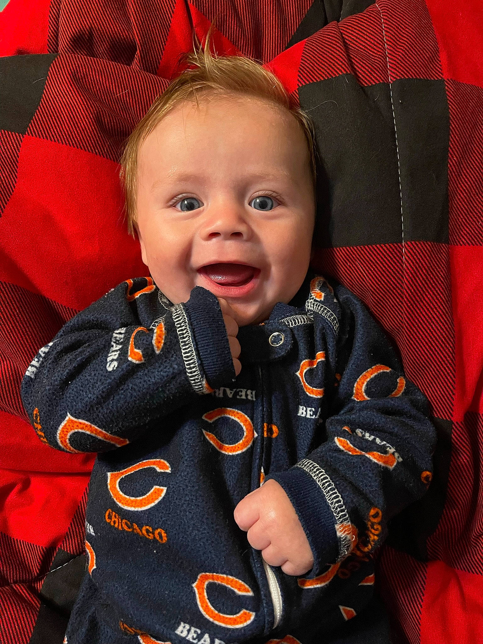 Lane is registered to the contest to win money with this photo: baby, baby_carriage, baby_products, baby_toddler_clothing, cheek, child, collar, comfort, face, gesture, happy, jacket, outerwear, person, product, red, skin, sleeve, smile, textile