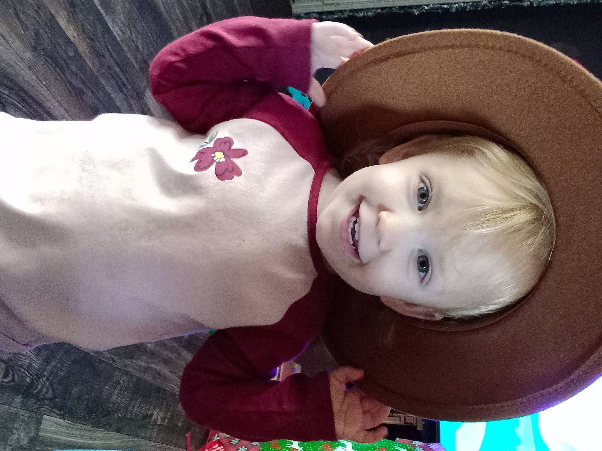 Whitley is registered to the contest to win money with this photo: baby, cap, carmine, child, costume, costume_hat, facial_expression, fashion_accessory, fun, fur, happy, hat, headgear, joy, lip, magenta, person, smile, sun_hat, textile