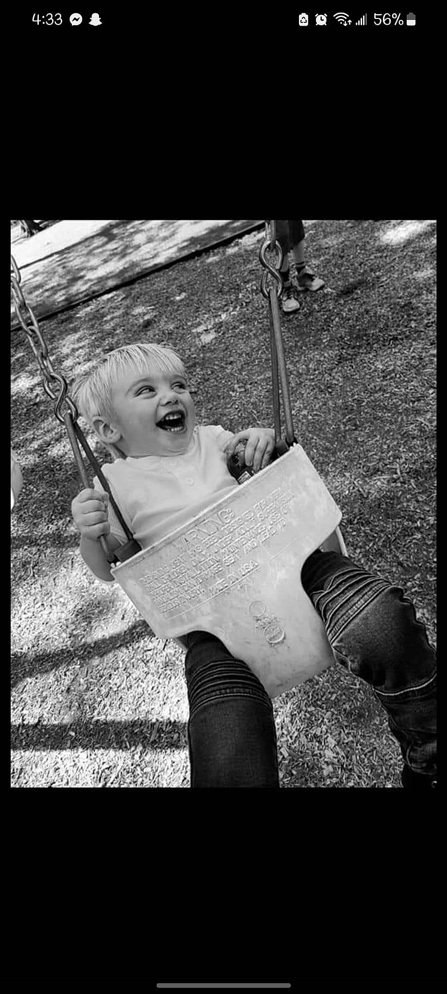 Malachi joined the competition — help win amazing prizes! adaptation, black, black_and_white, book, child, flash_photography, fun, grass, happy, monochrome, monochrome_photography, people_in_nature, person, photo_caption, reading, sitting, smile, style, swing, toddler