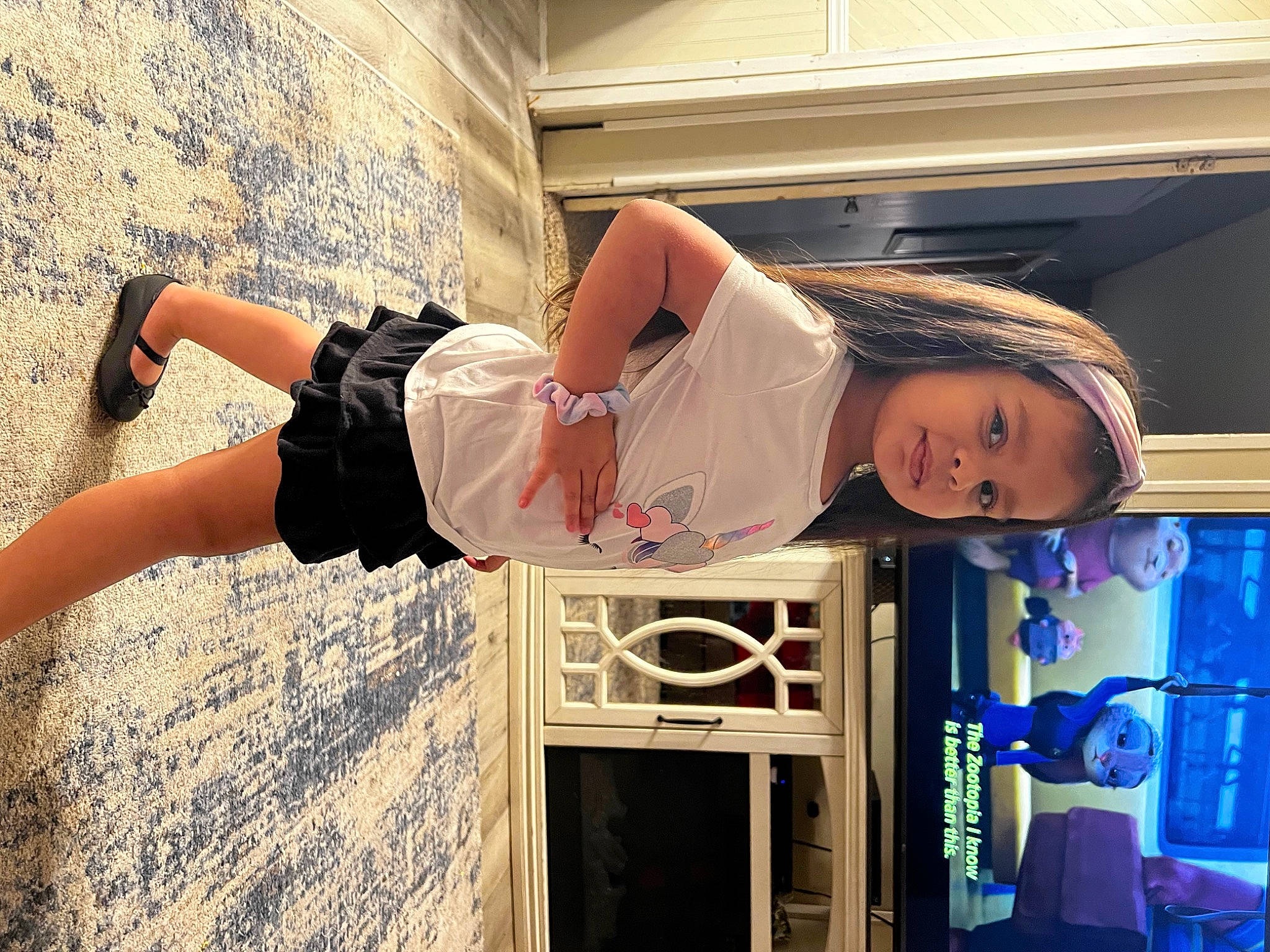 Natalie is registered to the contest to win money with this photo: blue, chair, child, elbow, eyewear, flash_photography, fun, hairstyle, happy, human_leg, knee, leisure, person, room, shorts, shoulder, sitting, smile, thigh, vacation