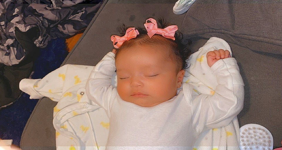 Estella is registered to the contest to win money with this photo: baby, baby_products, baby_safety, baby_sleeping, baby_toddler_clothing, bedtime, cheek, child, comfort, ear, headgear, iris, linens, lip, pattern, peach, person, skin, sleep, sleeve