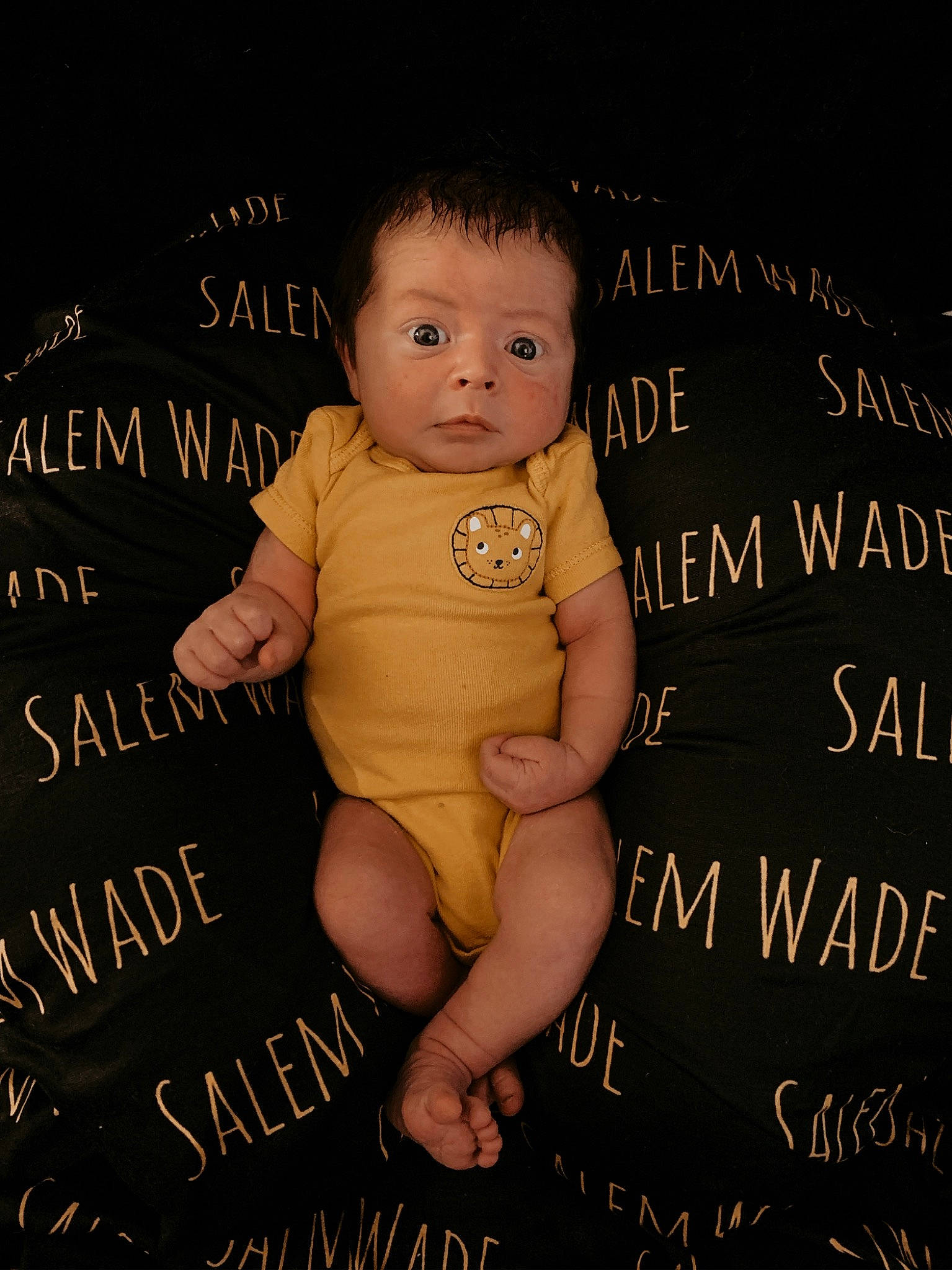 Salem is registered to the contest to win money with this photo: baby, baby_toddler_clothing, beauty, cheek, child, eye, facial_expression, flash_photography, font, foot, gesture, happy, human, illustration, pattern, person, photo_caption, poster, stock_photography, thumb