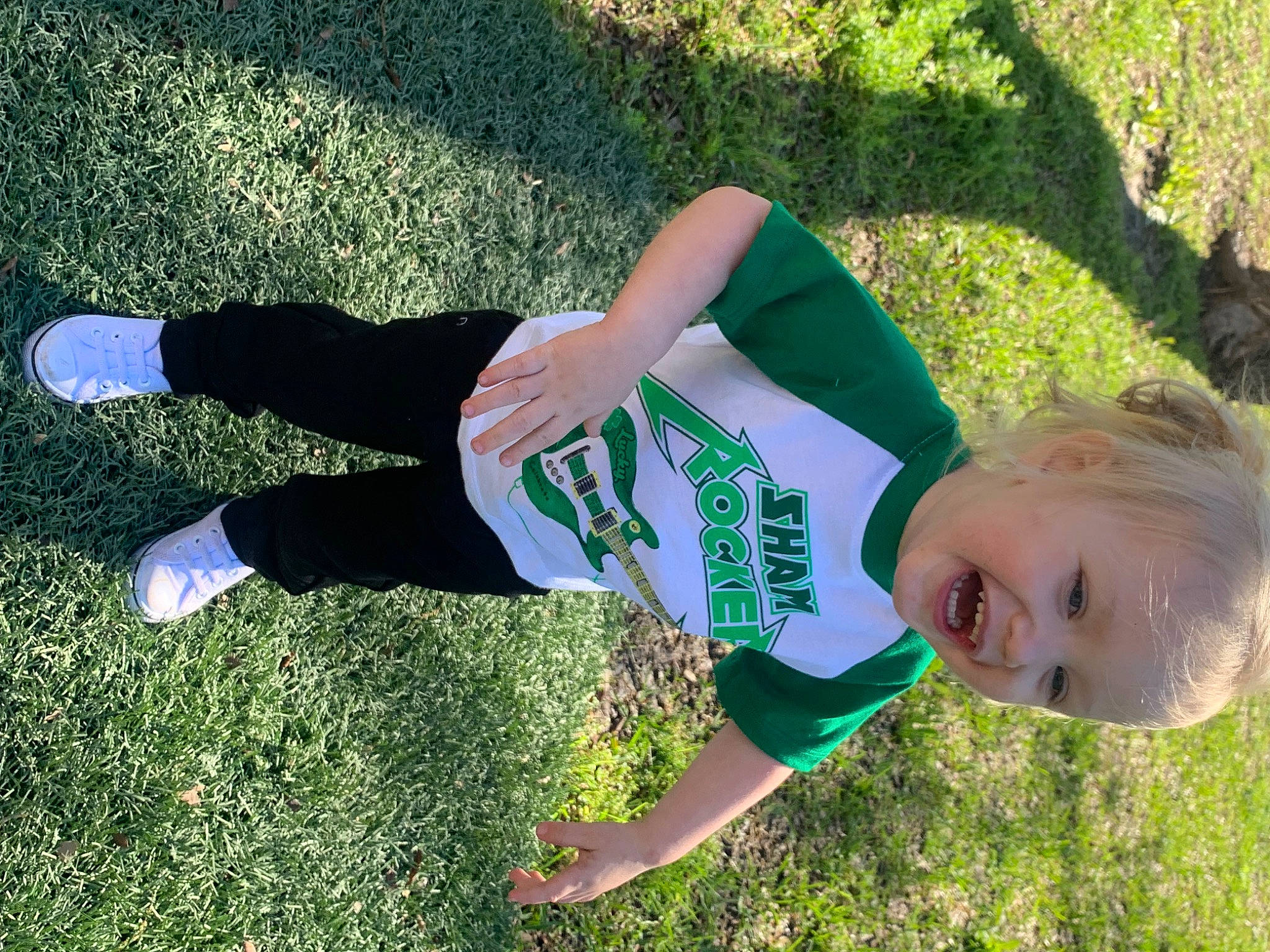 Greyson is registered to the contest to win money with this photo: fun, grass, grass_family, grassland, happy, human_leg, knee, lawn, leisure, people_in_nature, person, plant, recreation, smile, soil, sportswear, spring, t_shirt, thigh, toddler